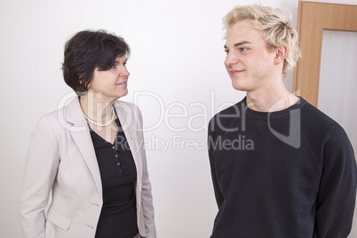 business woman and young man converse