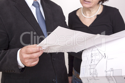 man and woman with blueprint