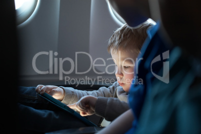 little boy traveling in an airplane