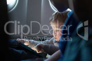 little boy traveling in an airplane