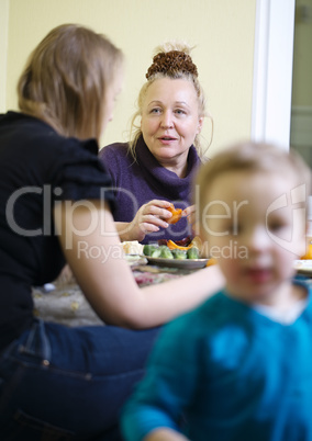 elderly mother and daughter enjoying a meal