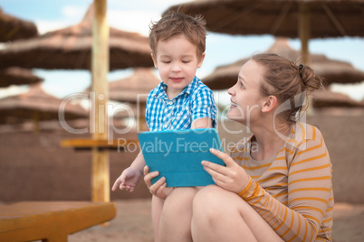 little boy with is mother at a beach resort