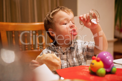 young boy enjoying lunch