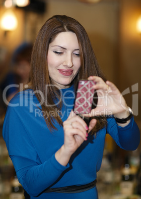 smiling young woman using a smartphone