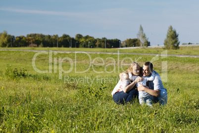 family of three having fun outdoors