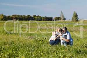 family of three having fun outdoors