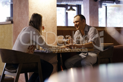 young couple in a cafe