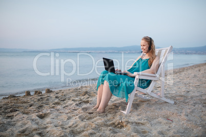 woman talking skype at the beach