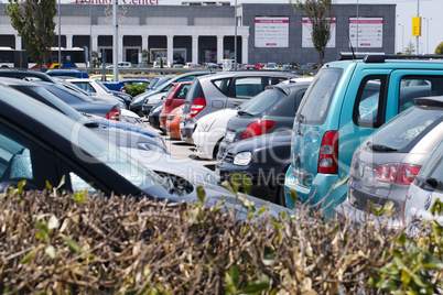 cars parked in an open-air car park