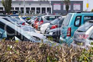 cars parked in an open-air car park