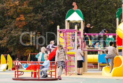 children playing in an outdoor playground