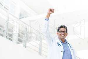 asian indian male medical doctor celebrating success