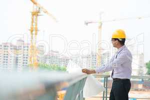 asian indian architect at construction site