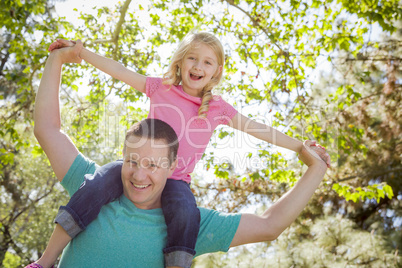 Cute Young Girl Rides Piggyback On Her Dads Shoulders