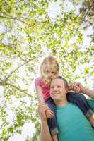 Cute Young Girl Rides Piggyback On Her Dads Shoulders