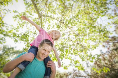 Cute Young Girl Rides Piggyback On Her Dads Shoulders