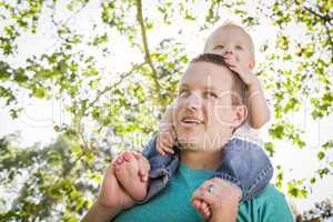 Cute Young Boy Rides Piggyback On His Dads Shoulders