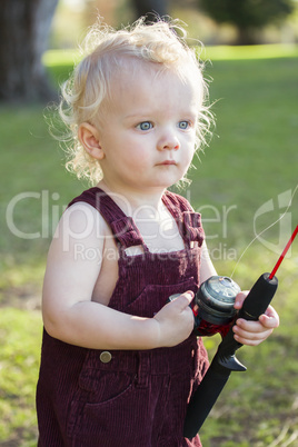 Cute Young Boy With Fishing Pole at The Lake