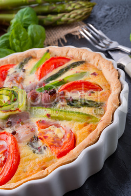 green asparagi tart with eggs and tomato