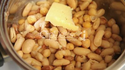 placing cheese on beans