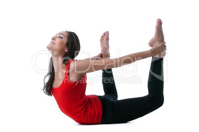 Beautiful slim woman doing stretching in studio