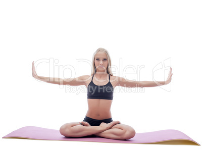 Image of attractive slim woman doing yoga on mat