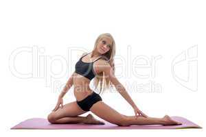 Beautiful slim long-haired blonde doing fitness