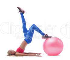 Model doing stretching exercises with fitness ball