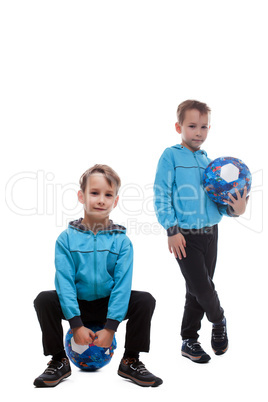 Cute sporty twin brothers isolated on white