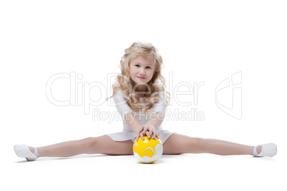 Image of pretty little gymnast posing on split