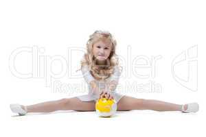 Image of pretty little gymnast posing on split