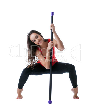 Beautiful athlete posing with fitbar in studio