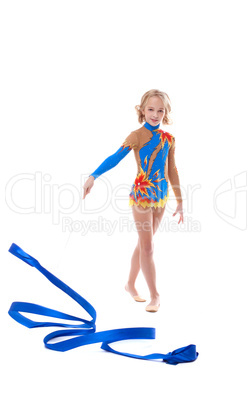 Image of cute little gymnast posing with ribbon