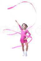 Adorable little gymnast dancing with ribbon