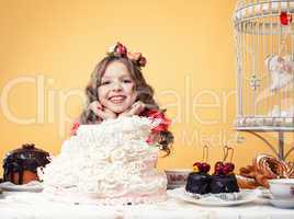 Happy smiling girl posing with lots of sweets