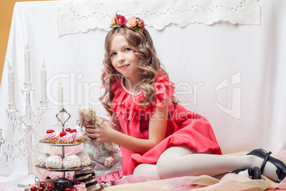 Image of beautiful little girl posing with doll