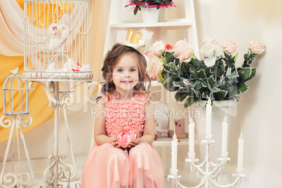 Beautiful little lady posing in vintage interior