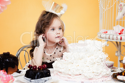 Fascinating little lady posing with tasty treats