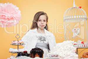 Lovely girl posing with sweet treats in studio