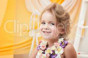Portrait of cute little girl smiling at camera