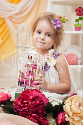 Portrait of lovely girl posing with flowers