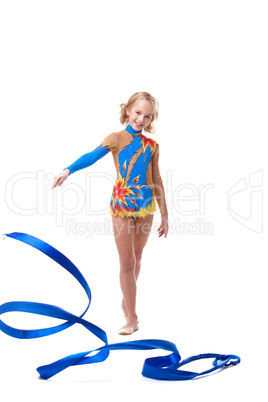 Happy artistic gymnast posing with ribbon