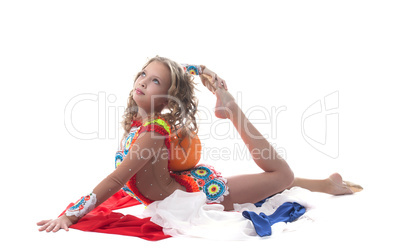 Graceful young sporty girl posing with ball