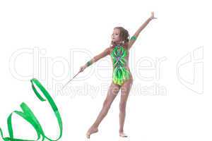 Elegant young gymnast dancing with ribbon