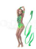 Image of lovely young gymnast posing with ribbon