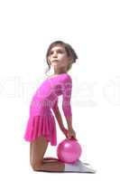 Image of cute little gymnast posing with ball