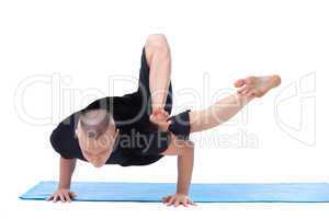 Studio shot of flexible man posing in asana