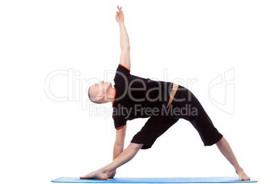 Energetic middle-aged man doing yoga poses