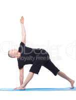 Yoga. Flexible man practising in studio
