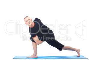 Attractive man posing in difficult yoga position